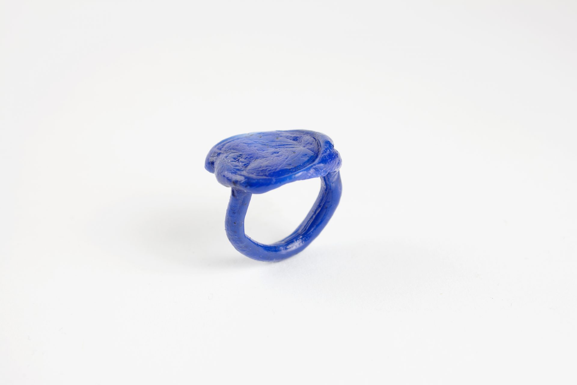 close up maro photography of a fine art unique Plastic doodle Ring out of recycled blue HDPE plastic linking to our ring collection