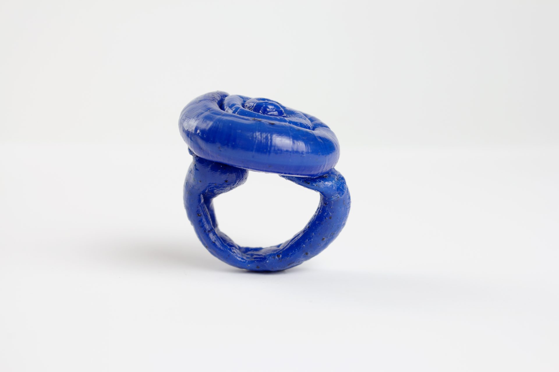 photography of a fine art unique Plastic doodle Ring out of recycled blue HDPE plastic linking to our ring collection