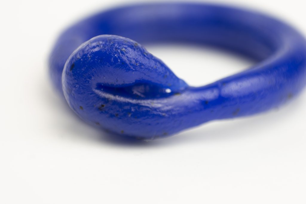 close up maro photography of a fine art unique handmade Plastic doodle Ring out of recycled blue HDPE plastic linking to our ring collection